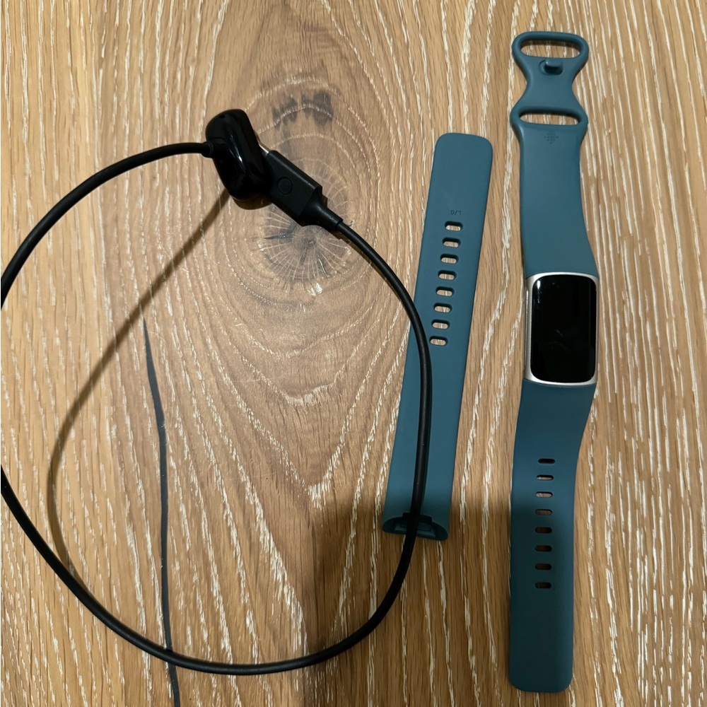 Fitbit charge 5 activity tracker platinum with a mineral blue band!